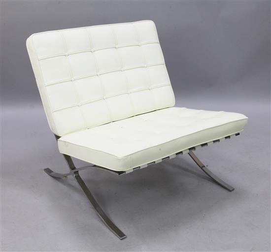 A chrome and white leather Barcelona chair, W.2ft 7in. H.2ft 7in.